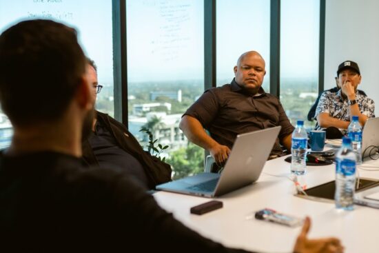 f1_featured_v5_716 Isaac Ovid in strategic session evaluating digital strategy and AI tools